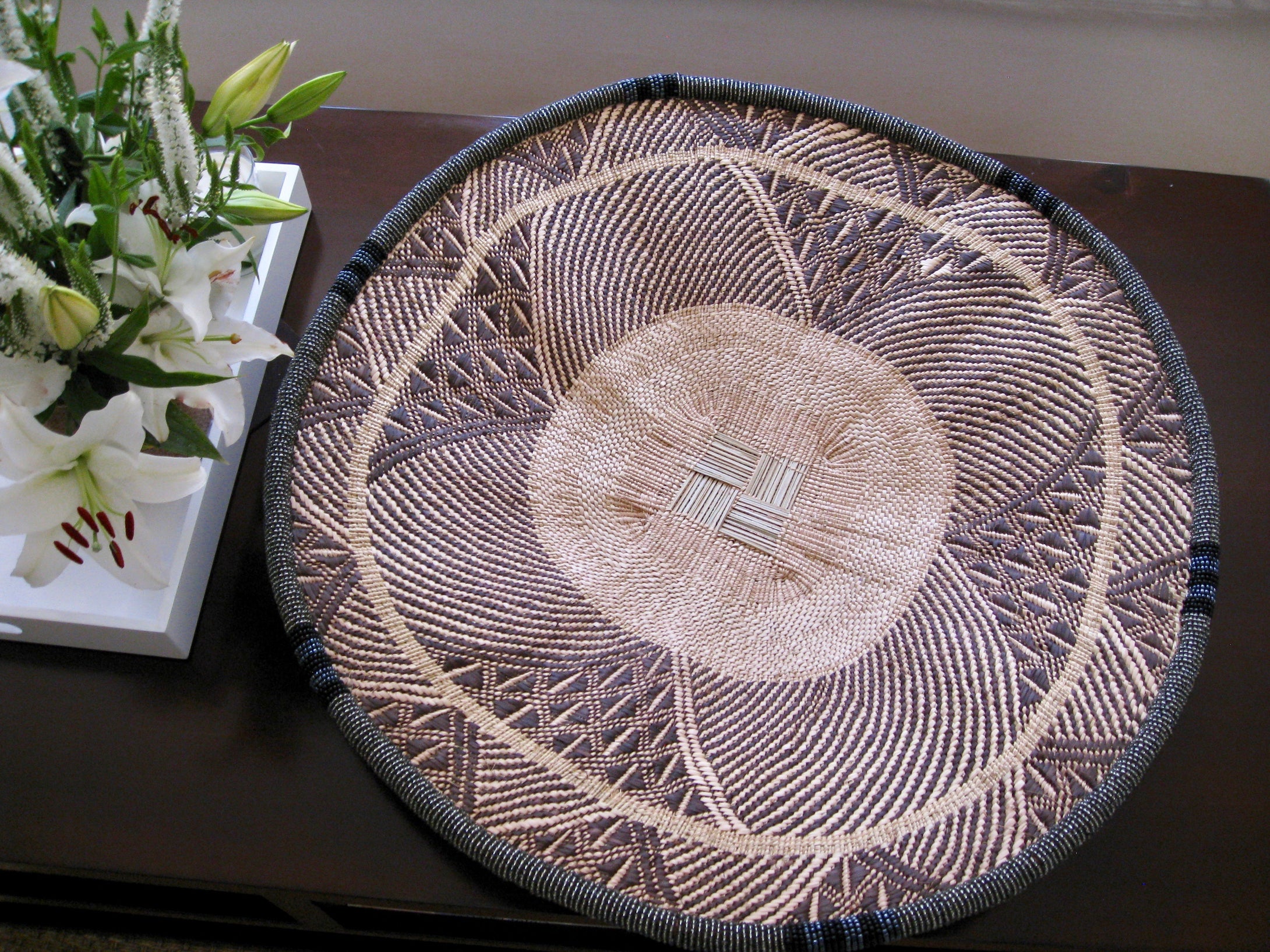 Large handwoven dark gray beaded basket