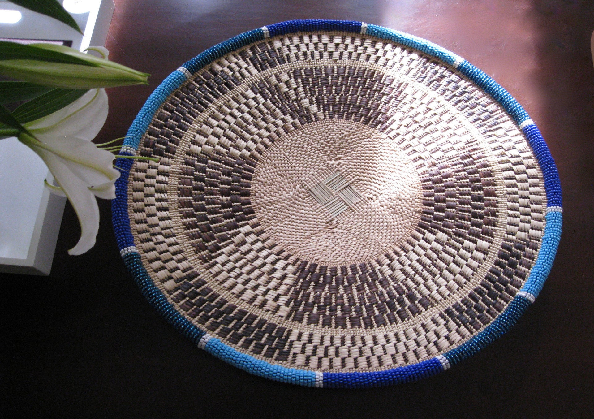 Medium handwoven blue and white beaded basket