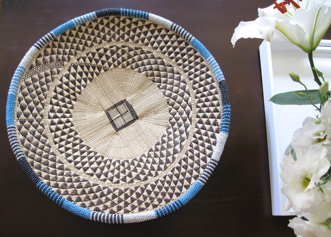 Medium handwoven light-blue beaded basket