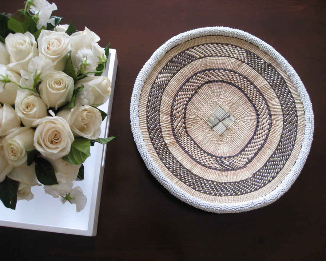 Small handwoven white beaded basket