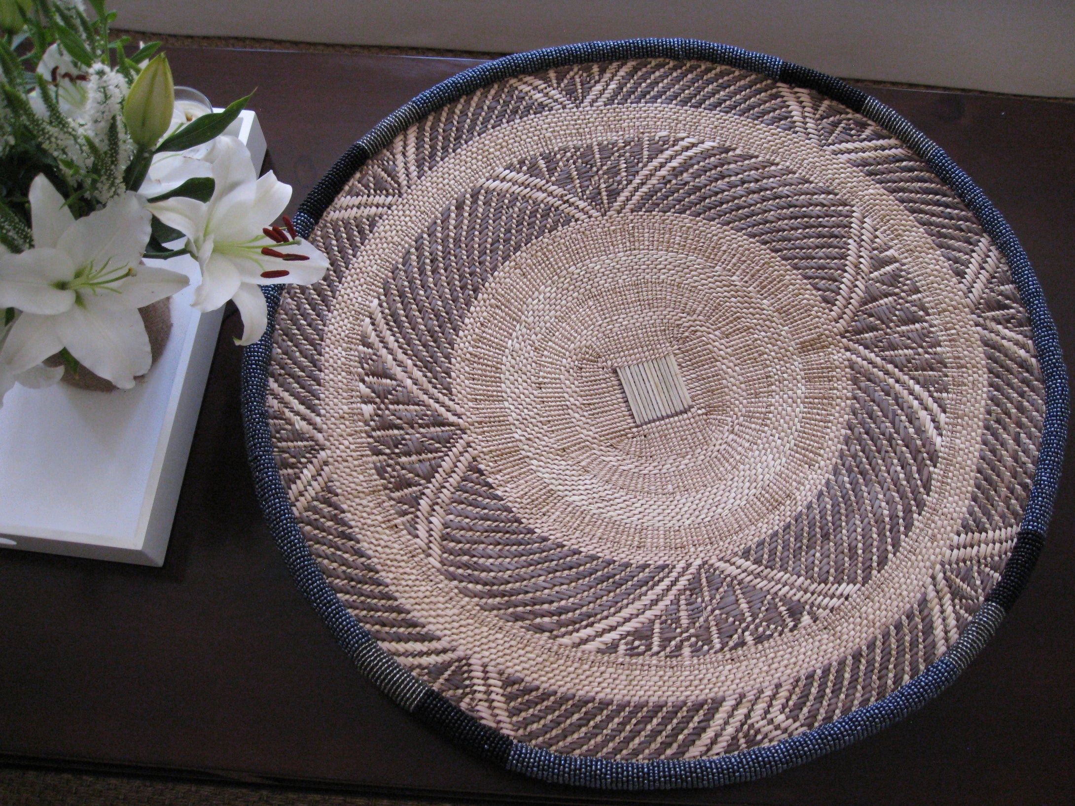 Large handwoven gray beaded basket 